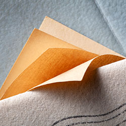 yellow papers emerging from an envelope